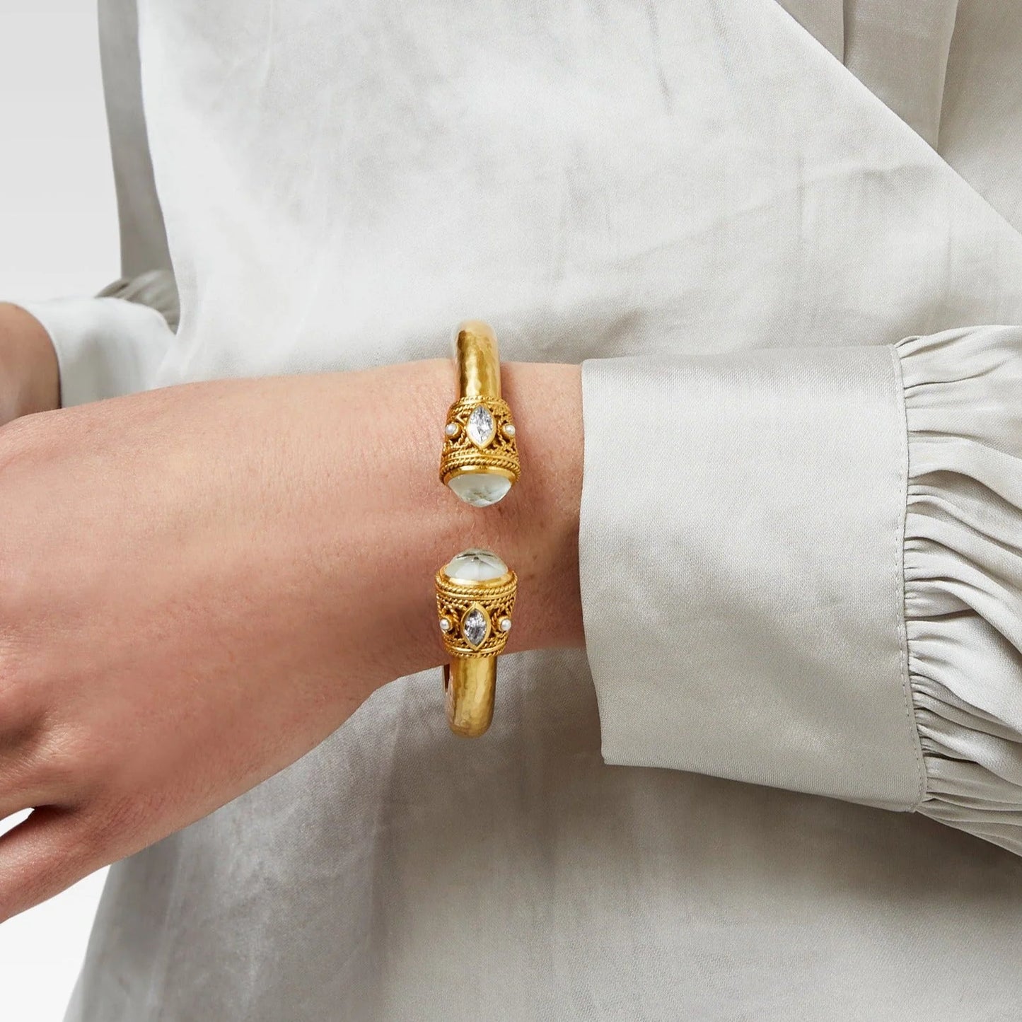 Monaco Demi Cuff Obsidian Black by Julie Vos. Lightly hammered shank with tiny, overlapping loops of twisted wire providing a textured base upon which a set of freshwater pearls and radiant CZ sit, finished with rose cut gemstone caps. 24K gold plate, table faceted glass, freshwater pearl cabochons, rose faceted glass doublet Diameter: 2.4". Shop at The Painted Cottage in Edgewater, MD.