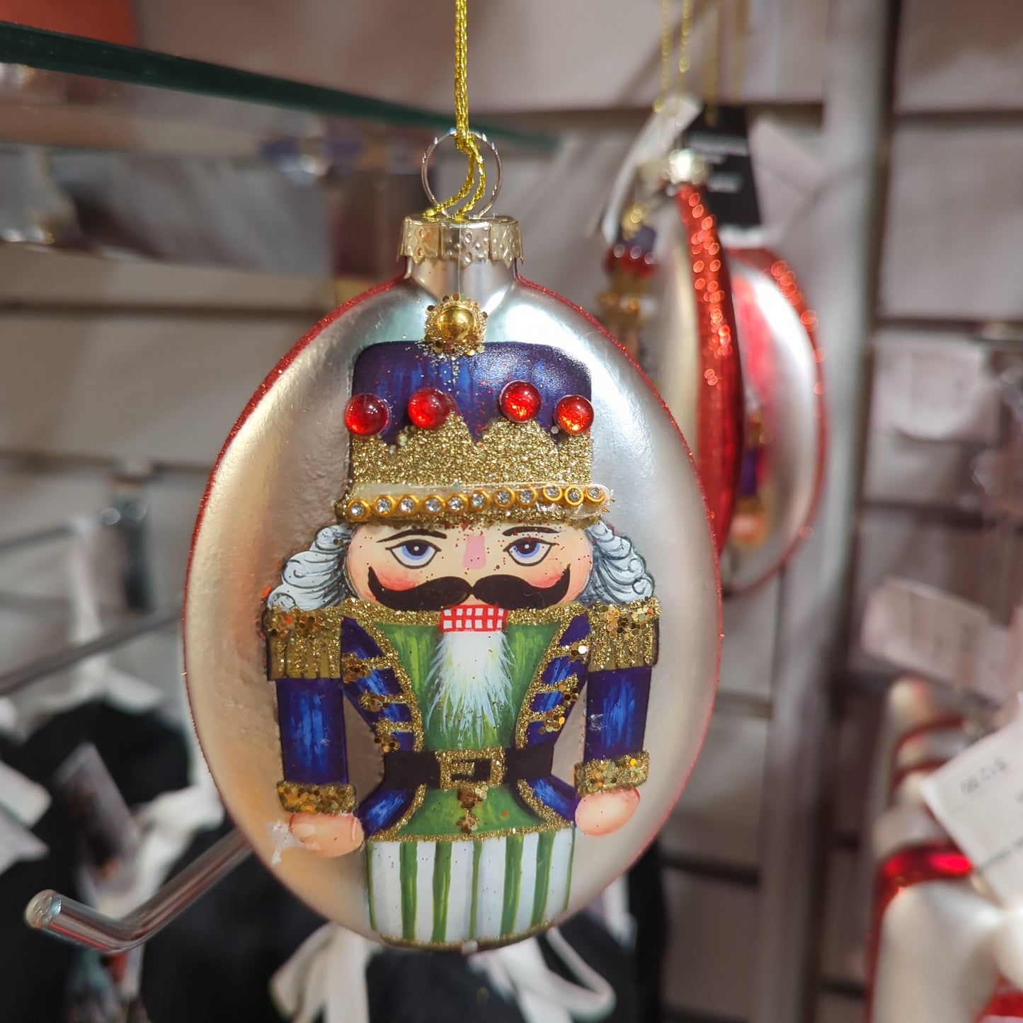 GLASS OVAL NUTCRACKER ORNAMENT BLUE