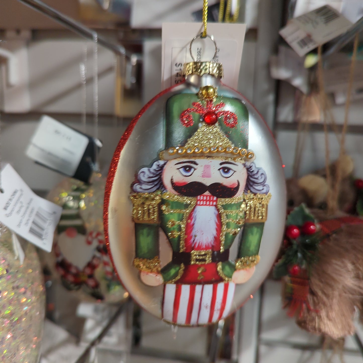 GLASS OVAL NUTCRACKER ORNAMENT GREEN