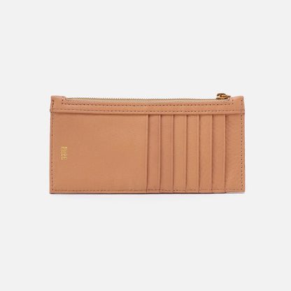 Carte Sandstorm by HOBO. Dimensions 6.5" W X 3" H X 0.5" D, features sandlewood lining exterior gusset: zip pocket, exterior front: 5 credit card slots & ID window; exterior Back: 6 credit card slots Old English Brass Hardware. Shop at The Painted Cottage in Edgewater, MD