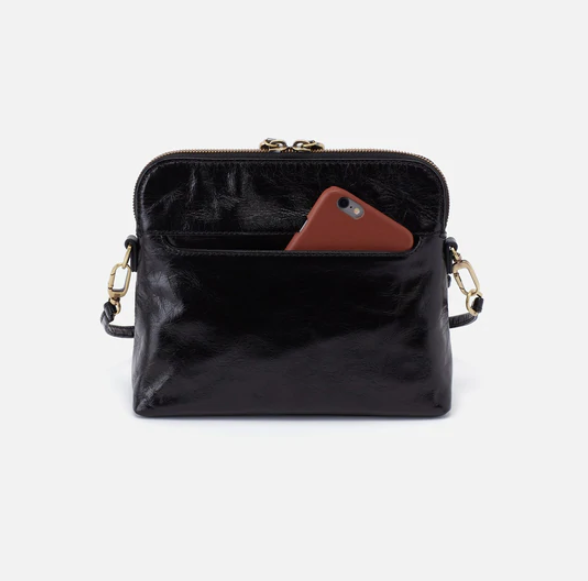 The Reeva crossbody in black by HOBO is perfect for everything from mornings at the coffeeshop to happy hour with friends. Adjust the strap to wear as a crossbody, short shoulder or wristlet for three looks in one! Crafted in our Vintage Hide leather that only gets more beautiful over time with use and wear. Shop for it at the Painted Cottage in Edgewater, MD