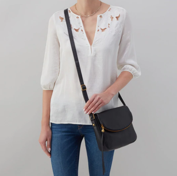 The Fern Messenger crossbody by HOBO pairs the iconic zipper closure with a foldover top and spacious interior, perfect for days when you need to carry a little more. Crafted in our Velvet Pebbled Hide, our softest and most casual leather that only gets more beautiful over time. Check it out at the Painted Cottage in Edgewater, MD