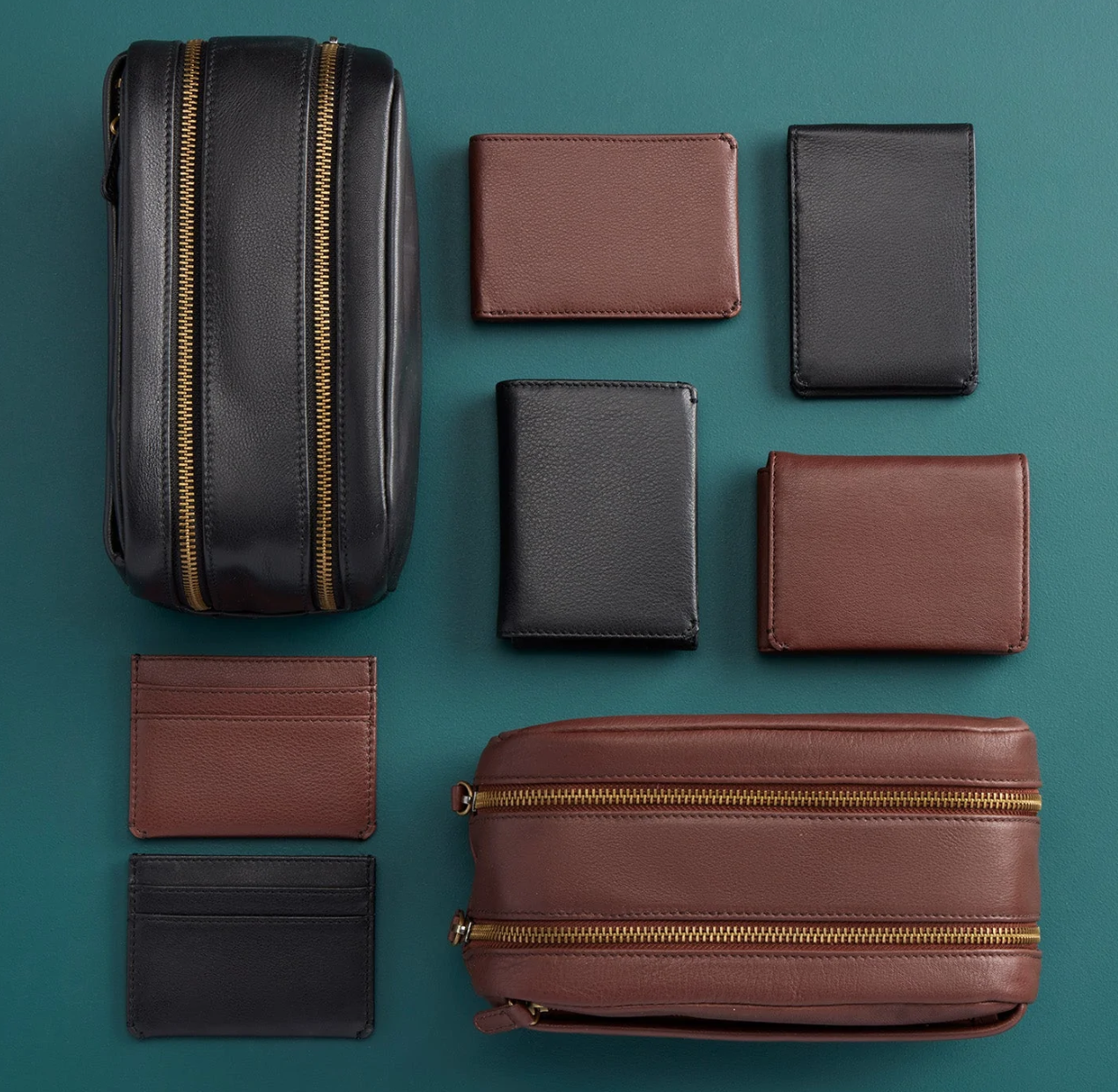 The Leather Men's Travel Kit in black has a two zipper compartments and a lined interior perfect for keeping your toiletries organized. For sale at the Painted Cottage in Edgewater, MD