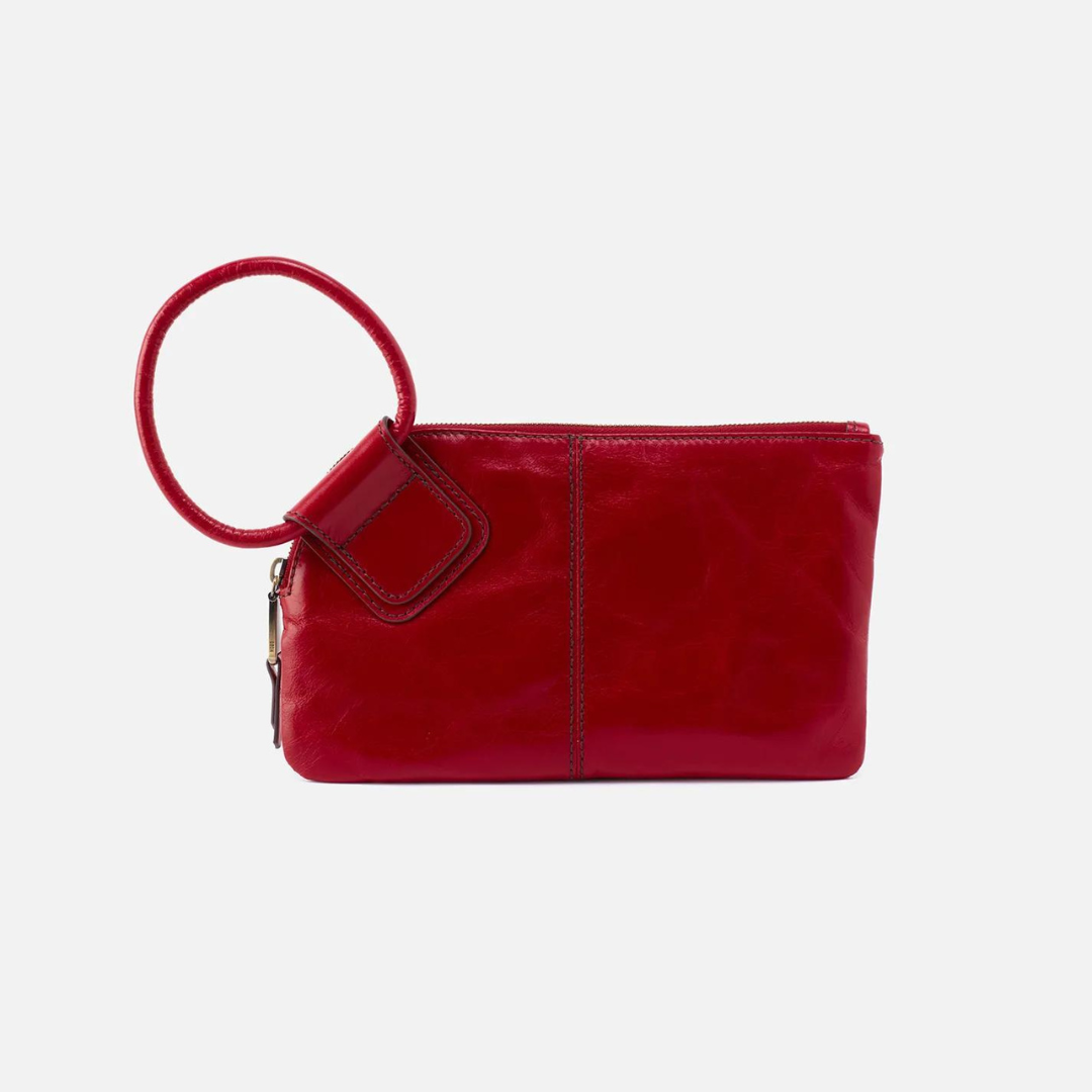 Designed with our signature circular handle, the Sable in crimson will securely stow away your essentials as you grab it and go. Crafted in our Vintage Hide leather that only gets more beautiful over time with use and wear. Available at the Painted Cottage in Edgewater, MD
