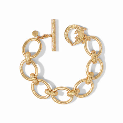 Alligator Link Bracelet by Julie Vos features hammered oval links with textured connecting links, finished with an alligator toggle ring and textured toggle. 24K gold plate, CZ. Shop at The Painted Cottage in Edgewater, MD.