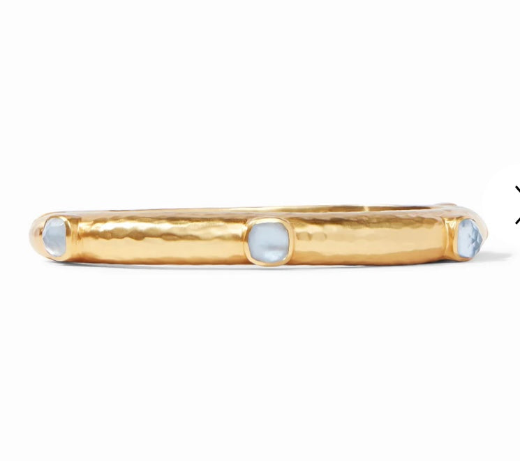 Catalina Hinge Bangle Chal Blue by Julie Vos. Lightly hammered bangle showcasing six stations of rose-cut imported glass with Chalcedony Blue stone adornments.  24K gold plate, imported glass, mother of pearl 2.5 inch diameter 0.325 inch width. Shop at The Painted Cottage in Edgewater, MD