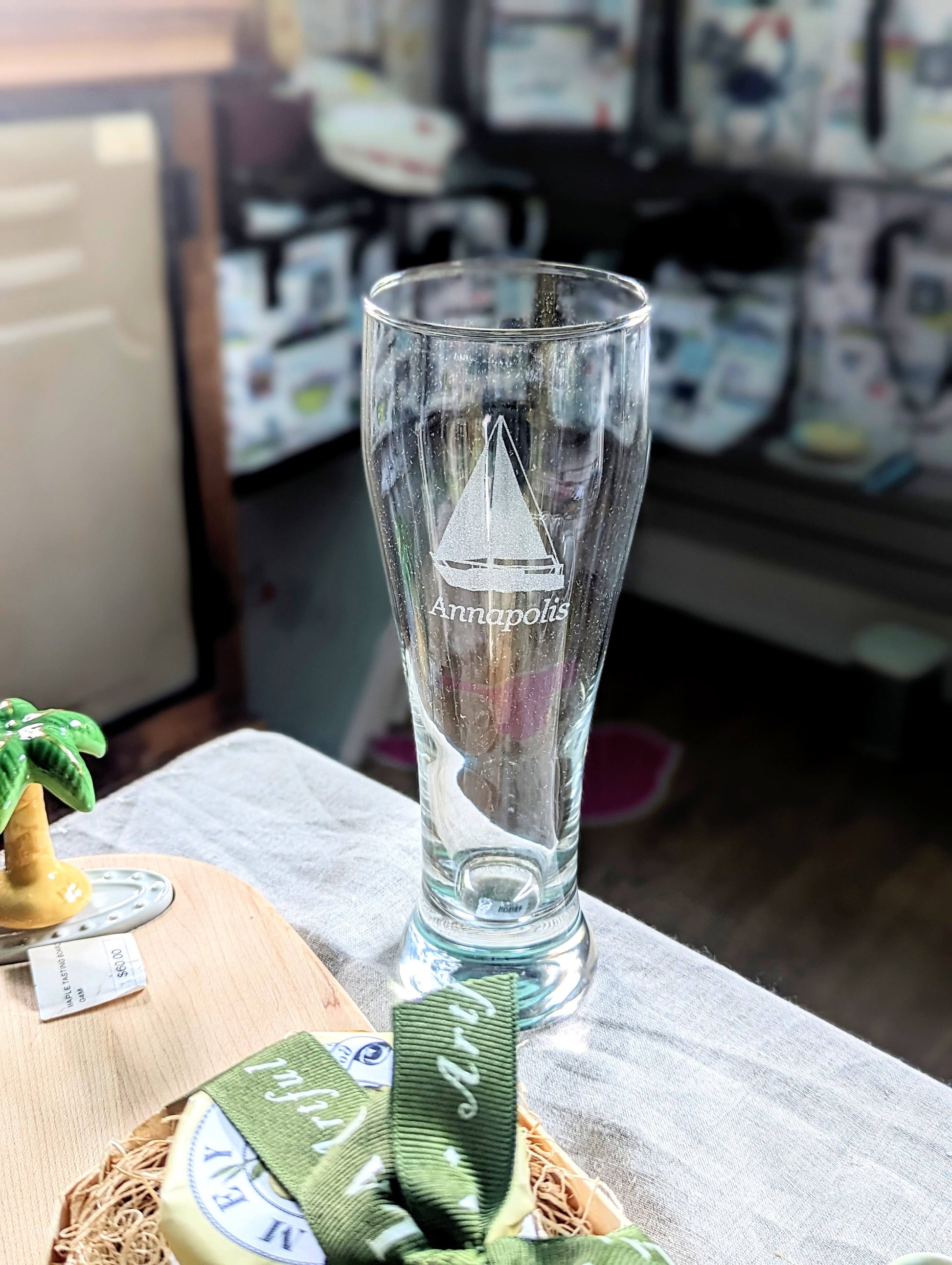 Annapolis Sailboat Pilsner Glass. Show your Annapolis pride with the etched sailboat and the city name beneath. A great Father's Day gift or for the avid sailor. Shop at The Painted Cottage in Edgewater, MD.