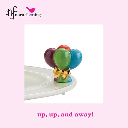 A277 Up Up and Away! Mini by Nora Fleming features red, blue, green and purple balloons with gold bow. Shop at the Painted Cottage in Edgewater, MD