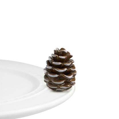 Nora Fleming Pretty Pinecone mini. Use to celebrate the Winter Solstice or anytime during winter months. Shop at The Painted Cottage in Edgewater MD.