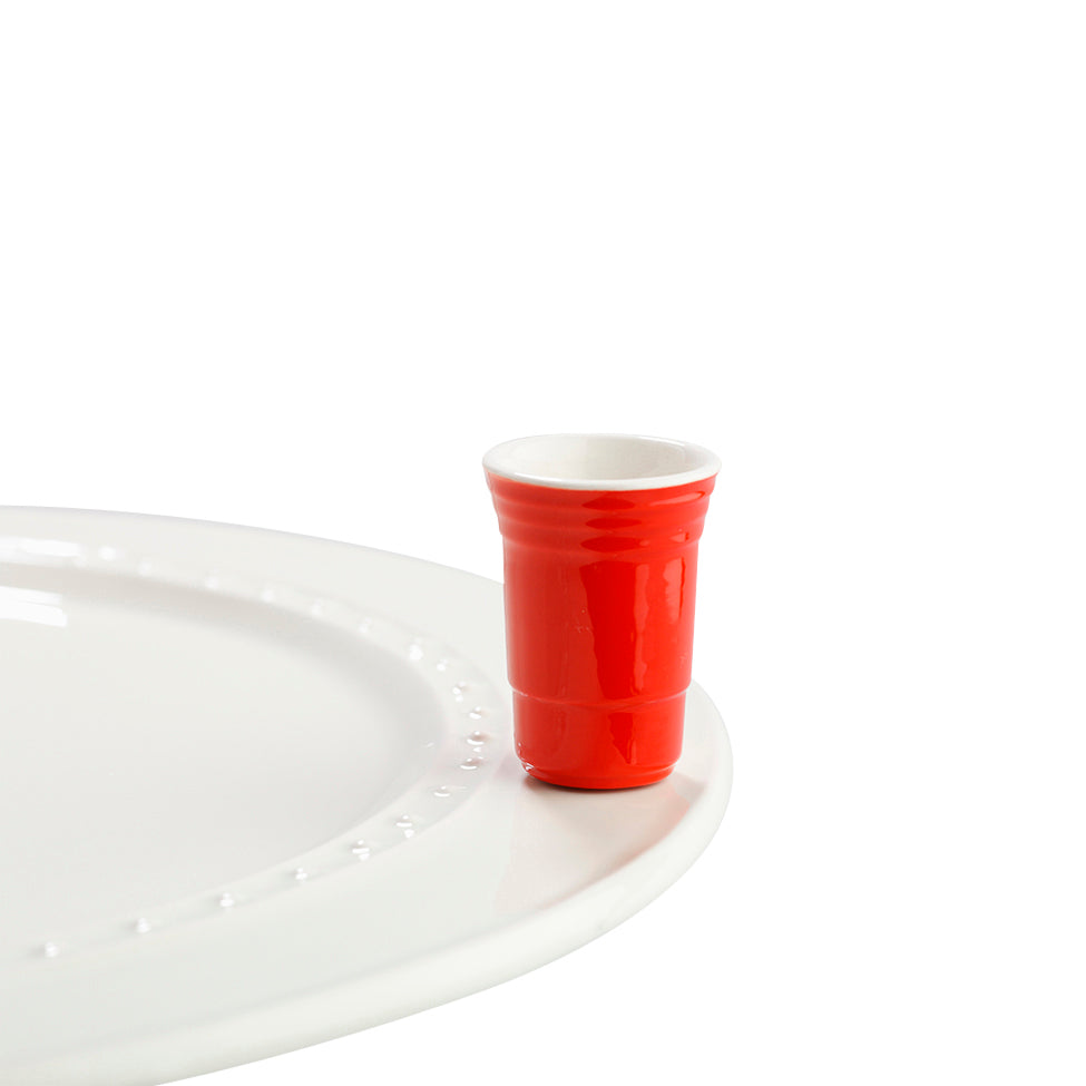Nora Fleming Fill Me Up red Solo mini. Can use to hold toothpicks for your appetizers. Shop at The Painted Cottage in Edgewater, MD.