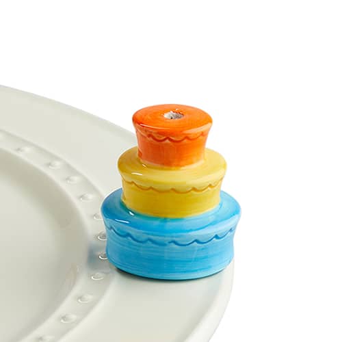 A194 Best Birthday Ever mini by Nora Fleming. Blue, yellow, orange birthday cake mini features a spot to place candle. Shop at The Painted Cottage in Edgewater MD.