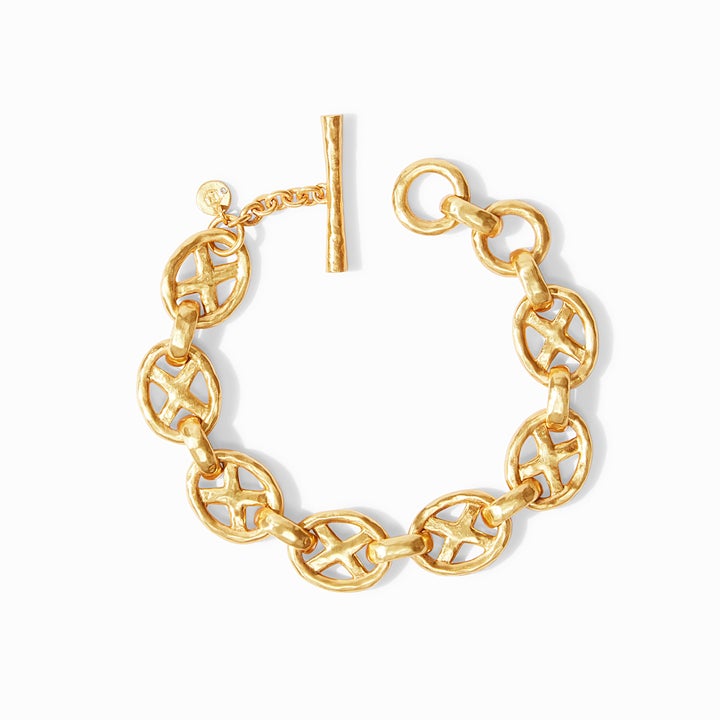 Avalon Demi Link Bracelet by Julie Vos features lightly hammered oval links with X motif and toggle closure, measures 7.5" length, 24K gold plate. Shop at The Painted Cottage in Edgewater, MD.