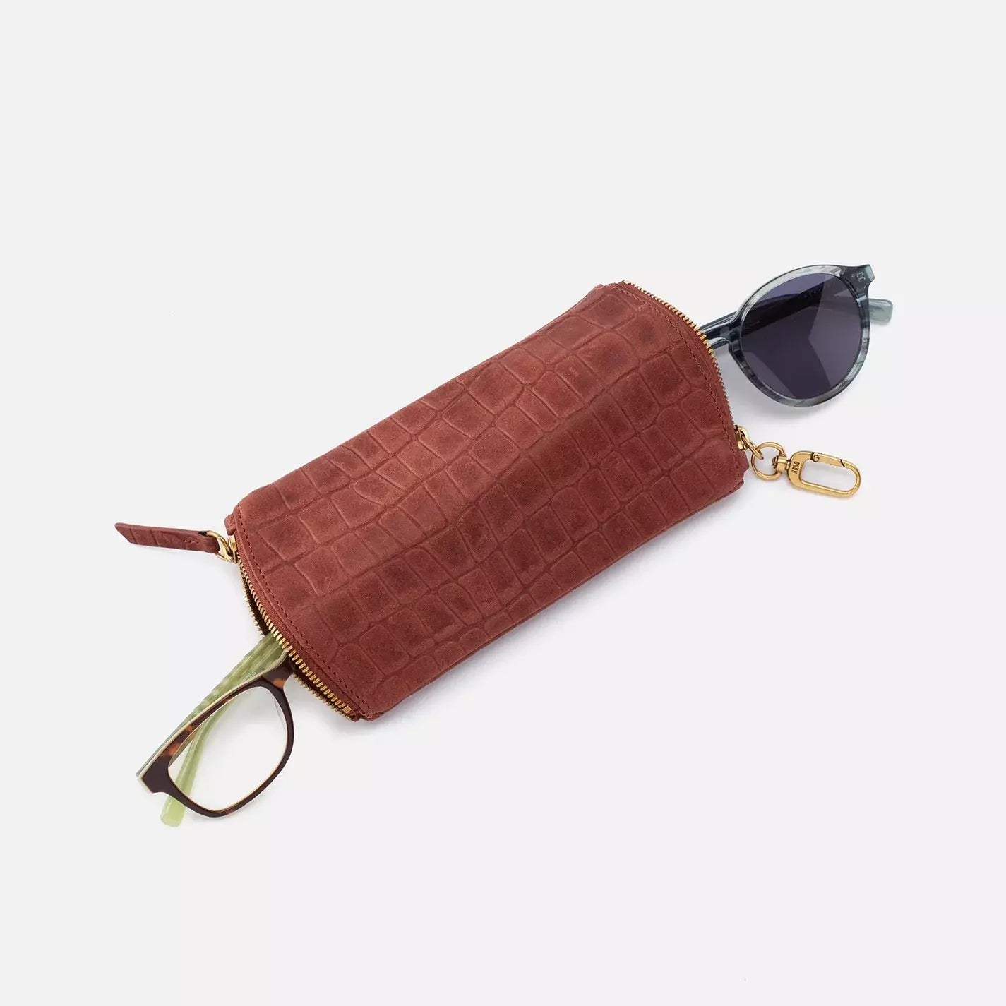 The Spark in brandy brown is a double eyeglass case that has an easy-to-use clip for attaching to your bag and two compartments for your favorite glasses. Shop for it at the Painted Cottage in Edgewater, MD