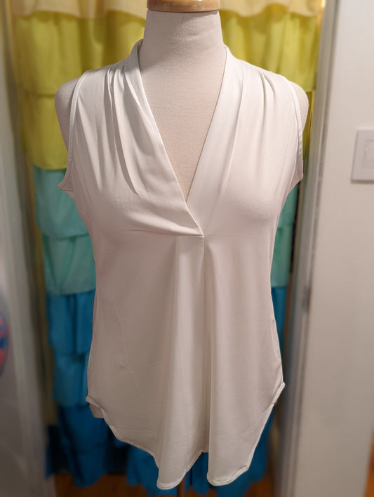 White SL Shannon pullover top in a poly/spandex blend. This top looks like a put together blouse with the feel of a relaxing tee