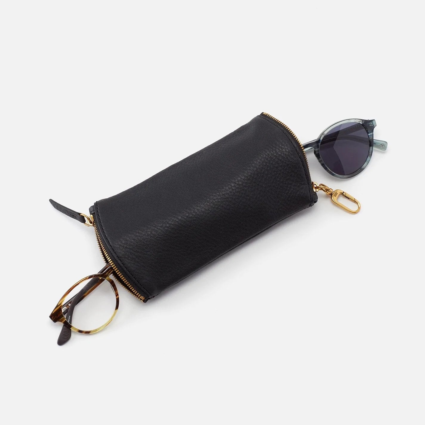 The Spark in black is a double eyeglass case that has an easy-to-use clip for attaching to your bag and two compartments for your favorite glasses. Shop for it at the Painted Cottage in Edgewater, MD