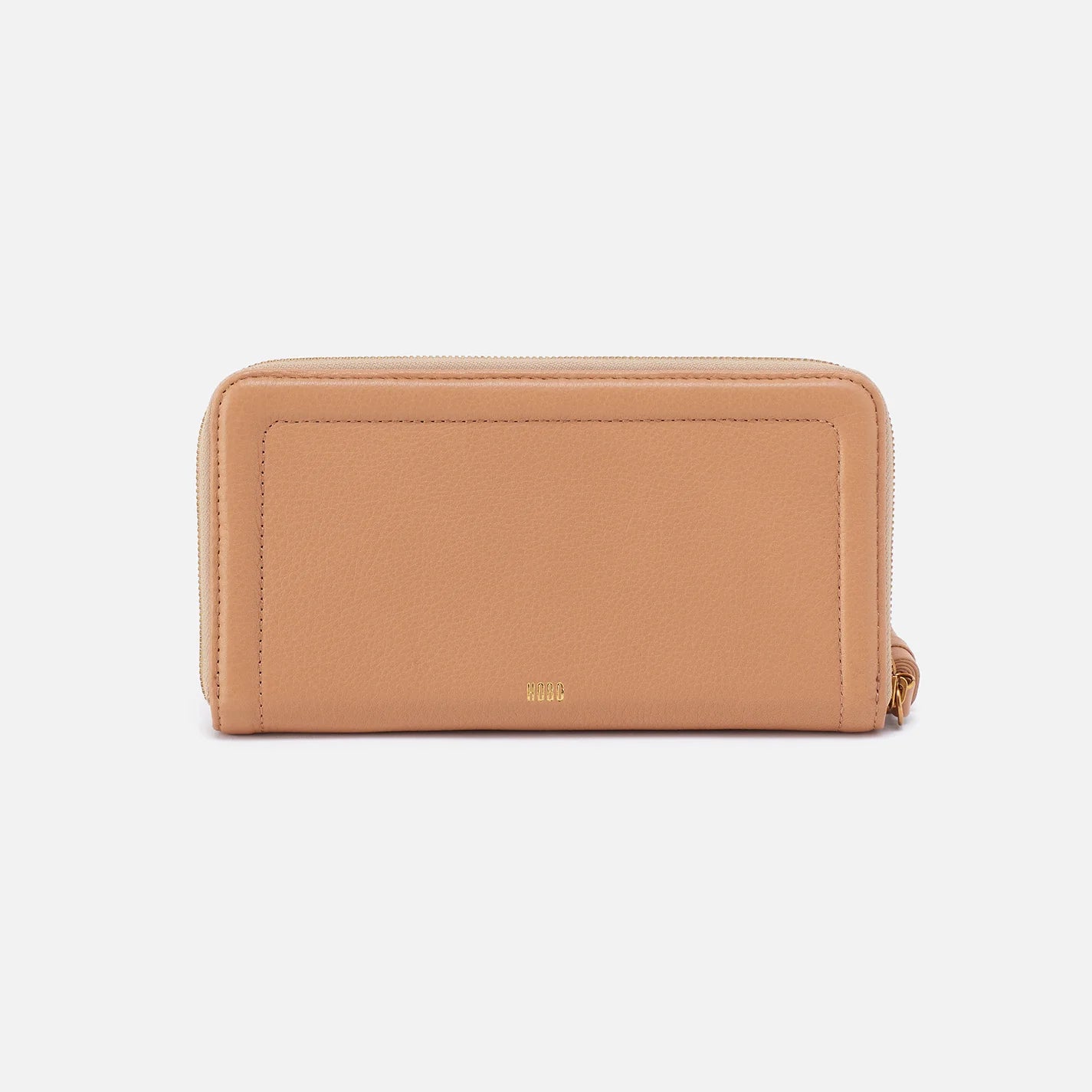 The Nila Large Zip Around Wallet in sandstorm is a continental design with interior organization for your cash and cards and a leather tassel zipper for added style and functionality. Available at the Painted Cottage in Edgewater, MD