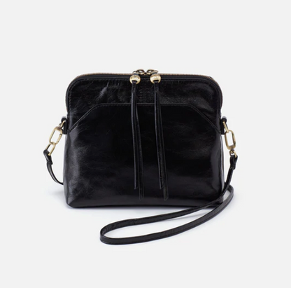The Reeva crossbody in black by HOBO is perfect for everything from mornings at the coffeeshop to happy hour with friends. Adjust the strap to wear as a crossbody, short shoulder or wristlet for three looks in one! Crafted in our Vintage Hide leather that only gets more beautiful over time with use and wear. Shop for it at the Painted Cottage in Edgewater, MD