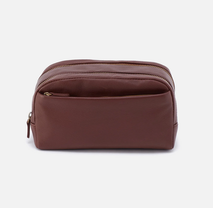 The Leather Men's Travel Kit in brown has a two zipper compartments and a lined interior perfect for keeping your toiletries organized. For sale at the Painted Cottage in Edgewater, MD