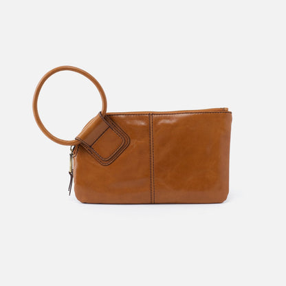 Designed with our signature circular handle, the Sable in truffle brown will securely stow away your essentials as you grab it and go. Crafted in our Vintage Hide leather that only gets more beautiful over time with use and wear. Check it out at the Painted Cottage in Edgewater, MD