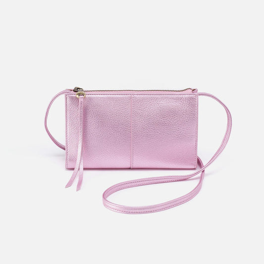 The Jewel in pink metallic by HOBO is a small crossbody designed to hold the essentials. It has a compact size with enough space for your phone, keys and cards. For sale at the Painted Cottage in Edgewater, MD