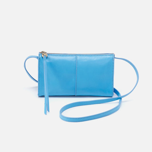 The Jewel in tranquil blue by HOBO is a small crossbody designed to hold the essentials. It has a compact size with enough space for your phone, keys and cards. For sale at the Painted Cottage in Edgewater, MD