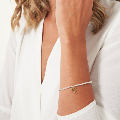 Katie Loxton silver stretch bead A Little Paw-fect bracelet with yellow gold pawprint charm