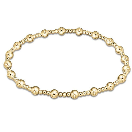 Classic Sincerity 4mm Gold bracelet by eNewton features classic gold beaded bracelet with alternating bead sizes. Shop at The Painted Cottage, MD
