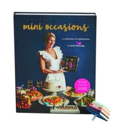 Nora Fleming Book "Mini Occasions" is her first heirloom keepsake book set with over 70 recipes, 13 party themes, and write-in pages to commemorate your Nora Fleming journey. Each book set contains an exclusive "mini occasions" mini. Shop at The Painted Cottage in Edgewater, MD.