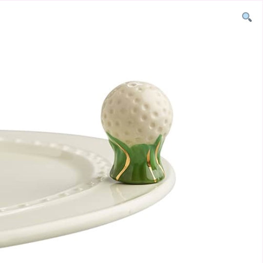 A57 Nora Fleming Hole in One golf ball mini with green and gold grass accents. Shop at The Painted Cottage in Edgewater MD.
