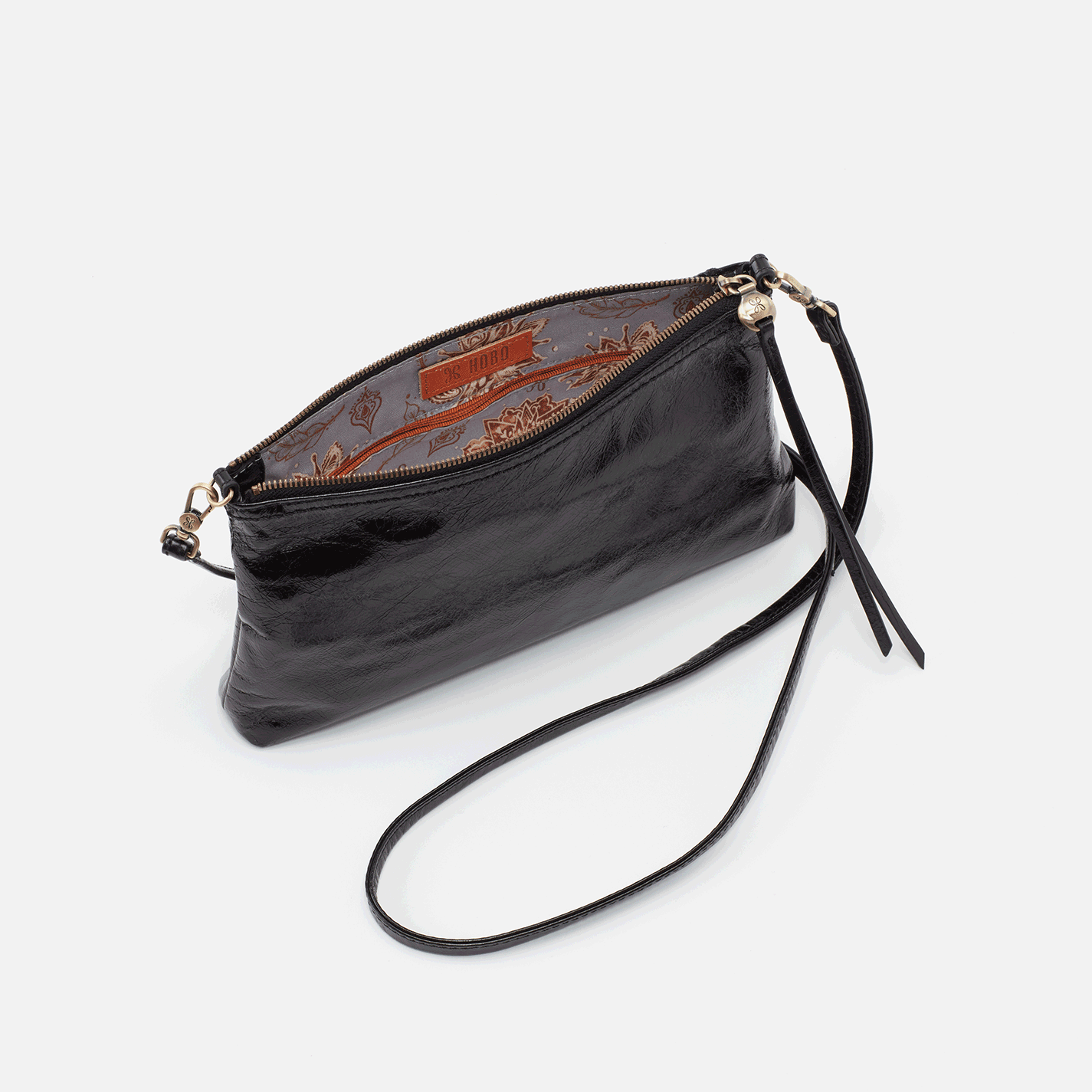 Darcy Black leather convertible bag can be worn three ways: crossbody, baguette bag and wristlet by HOBO. Available at The Painted Cottage in Edgewater, MD.