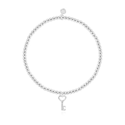 Silver-plated stretch bead A Little Happy New Home bracelet with silver heart key charm